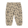 Beige Kinderhose mit blauen Blumenmuster, elastischer Bund, geeignet für gemütlichen Alltagslook und bequemes Tragegefühl.