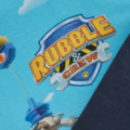 Rubble & Crew-Logo auf blauem Hintergrund mit Bau- und Werkzeugmotiv, inspiriert vom beliebten Kinderfernsehprogramm.